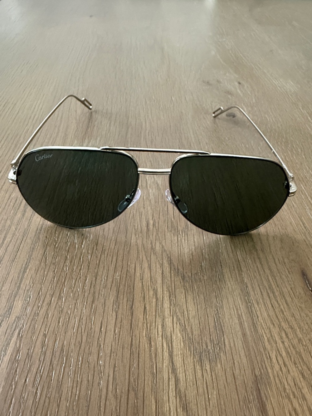 Cartier Silver Frame Sunglasses with Dark Green Lenses CT0110S004